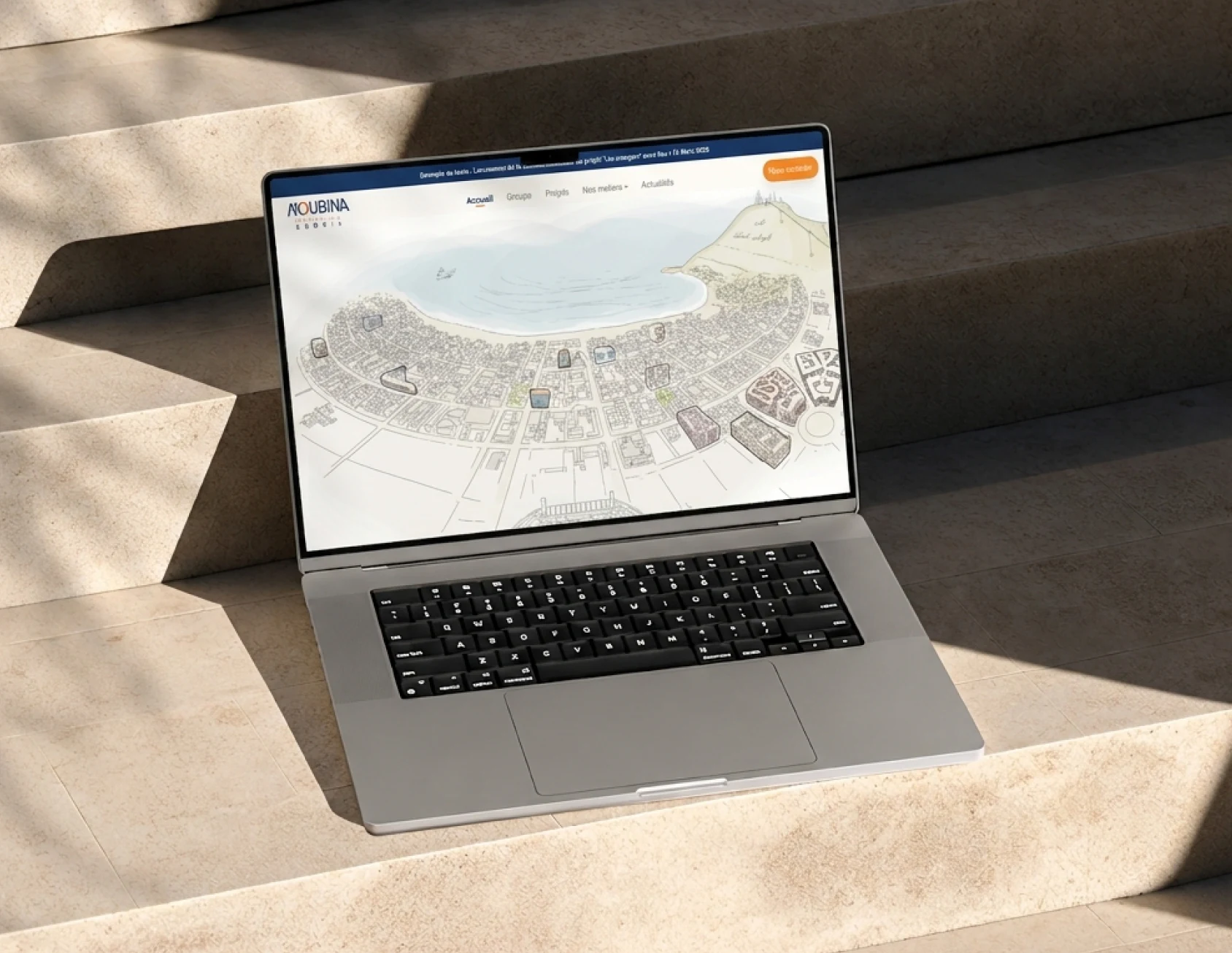 Moubina real estate website shown on a laptop